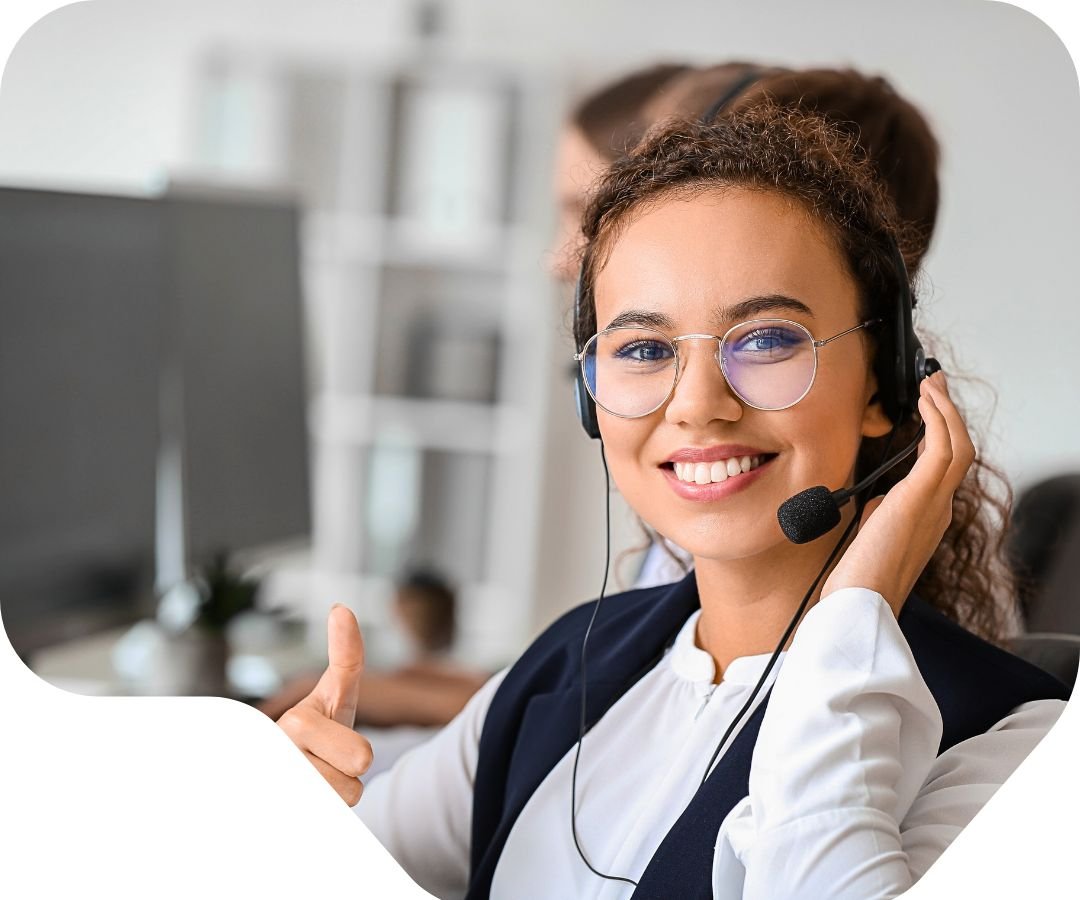 Customer service representative with headset smiling while providing debt settlement phone support and enrollment assistance