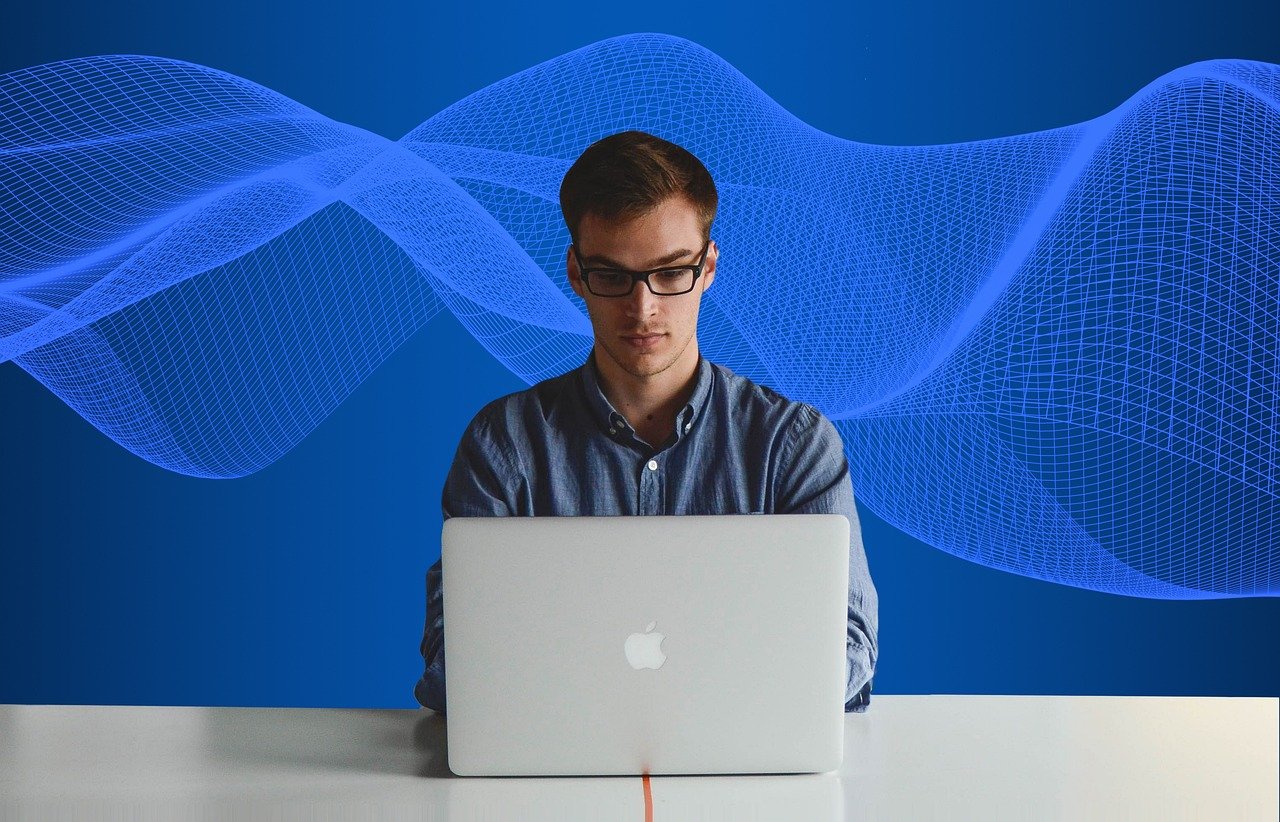 Business professional using laptop with digital data streams representing reverse email append customer profile enrichment and multi-channel marketing intelligence