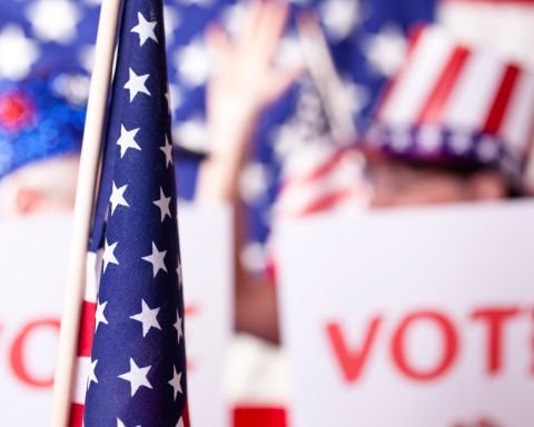 American flag with VOTE text and patriotic decorations for election day